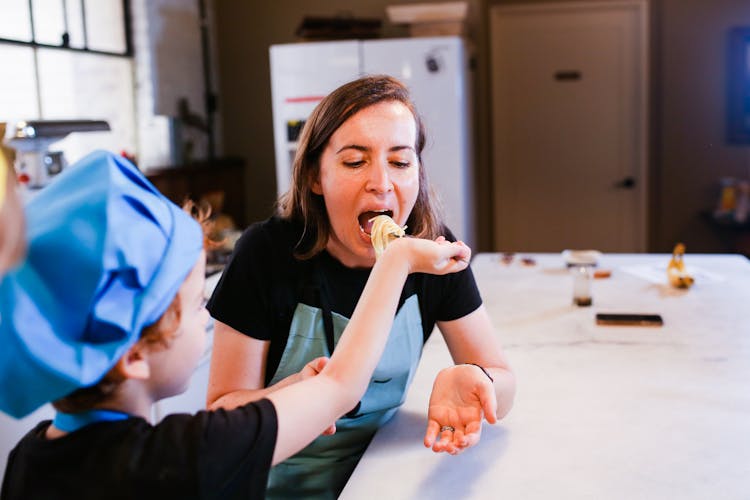 Woman In Black T-shirt Eating