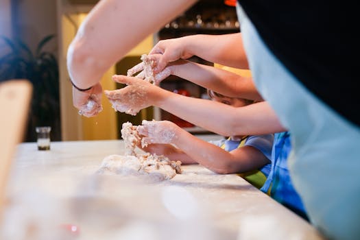 Engaging family cooking session with children making dough together.