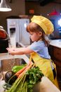 Girl in White T-shirt and Yellow Skirt in Kitchen