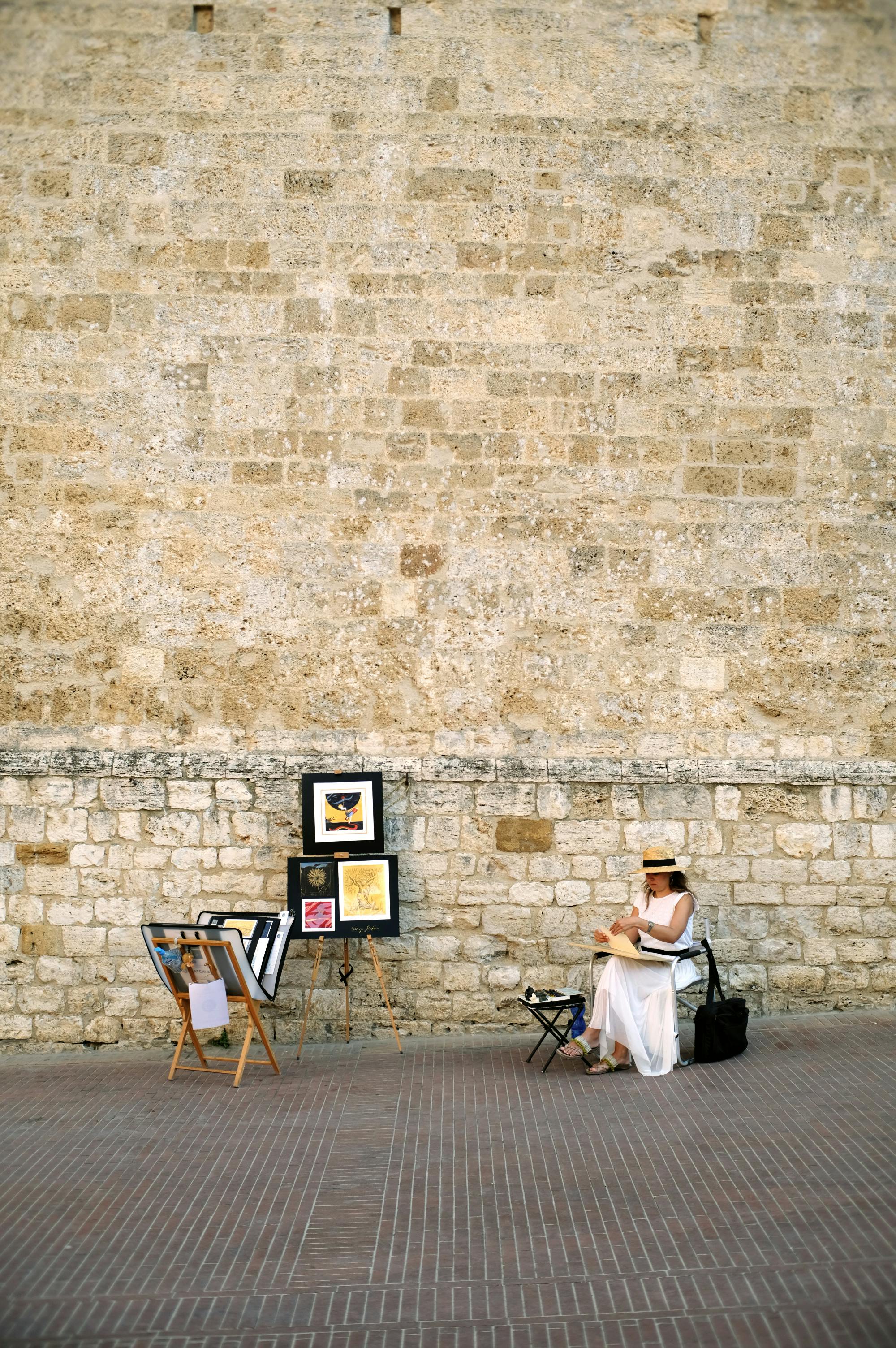 Woman Selling Paintings On A Street Free Stock Photo   Pexels Photo 5593919 