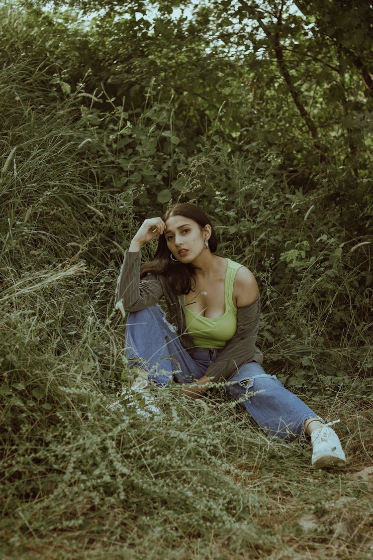 Young Woman Sitting In Shade