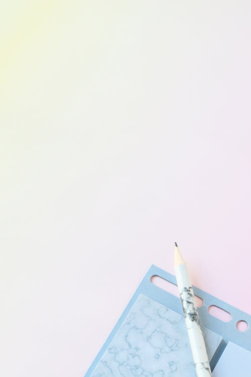Free Pencil on Notebook Stock Photo