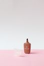 Pink Perfume Bottle on Pink Table