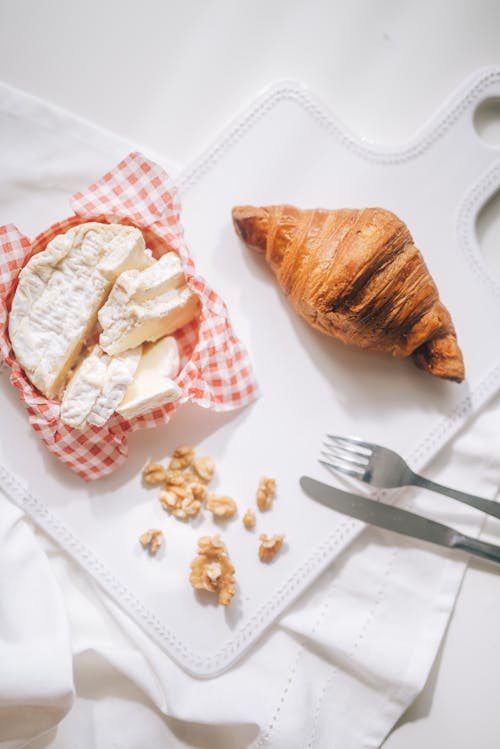 Free Croissant and Chees on White Wooden Chopping Board Stock Photo