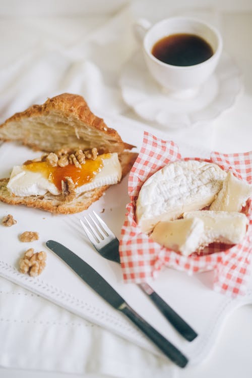 Free Bread and Coffee Beside the Silverware Stock Photo