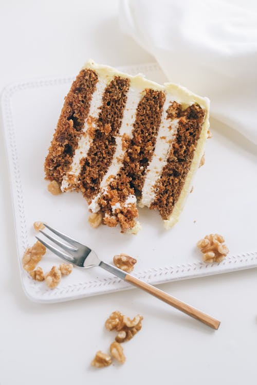 Free Sliced Carrot Cake on a White Plate Stock Photo