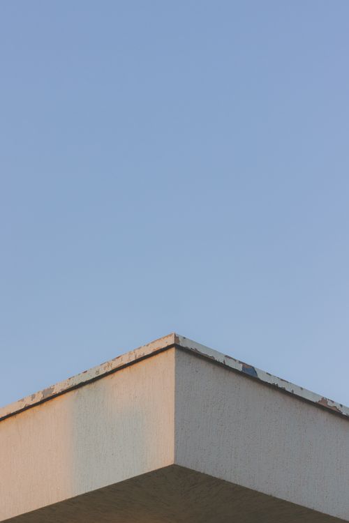 Corner Roof Of a House Under Clear Blue Sky · Free Stock Photo