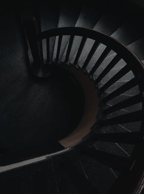 Free Black Spiral Staircase With Black Metal Railings Stock Photo