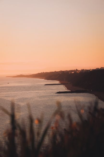 Peaceful sunset view over Black Rock, VIC, Australia, highlighting serene coastline and golden sky.