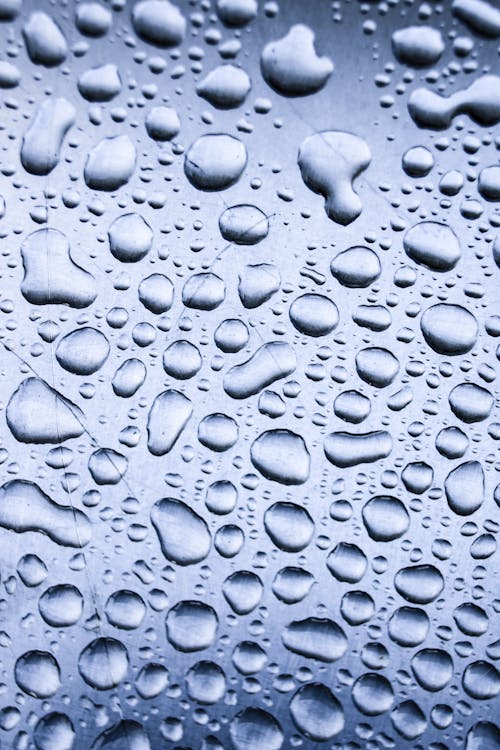 Free Water Droplets on Glass Surface Stock Photo