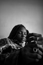 Serious black woman sitting with closed eyes