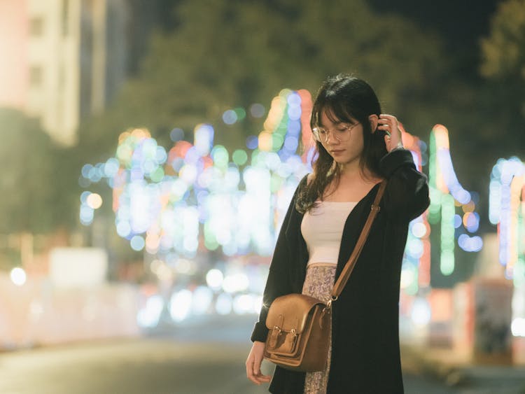 Woman Walking Through City Street St Night