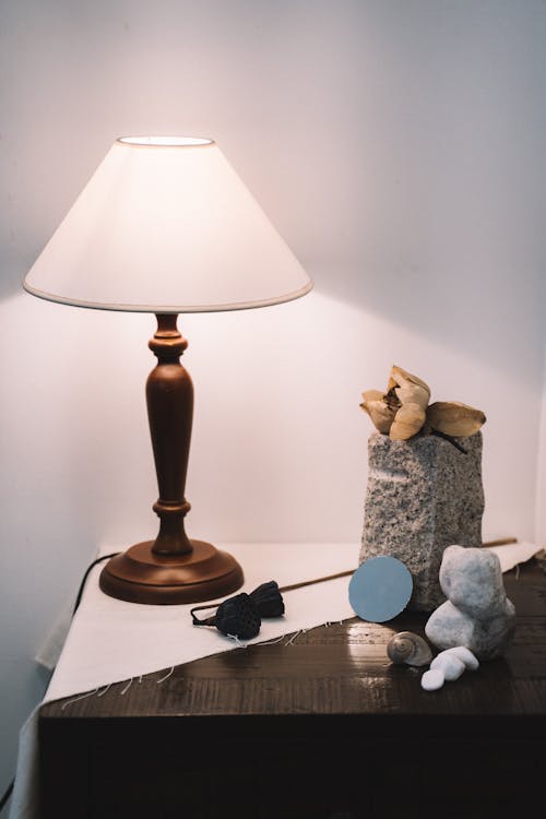 Brown and White Table Lamp on Brown Table