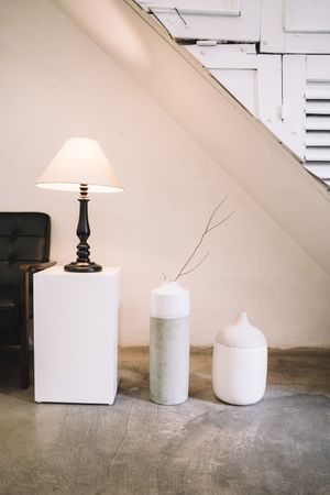 Interior with a minimalist lamp and vases by Anna Tarazevich on Pexels