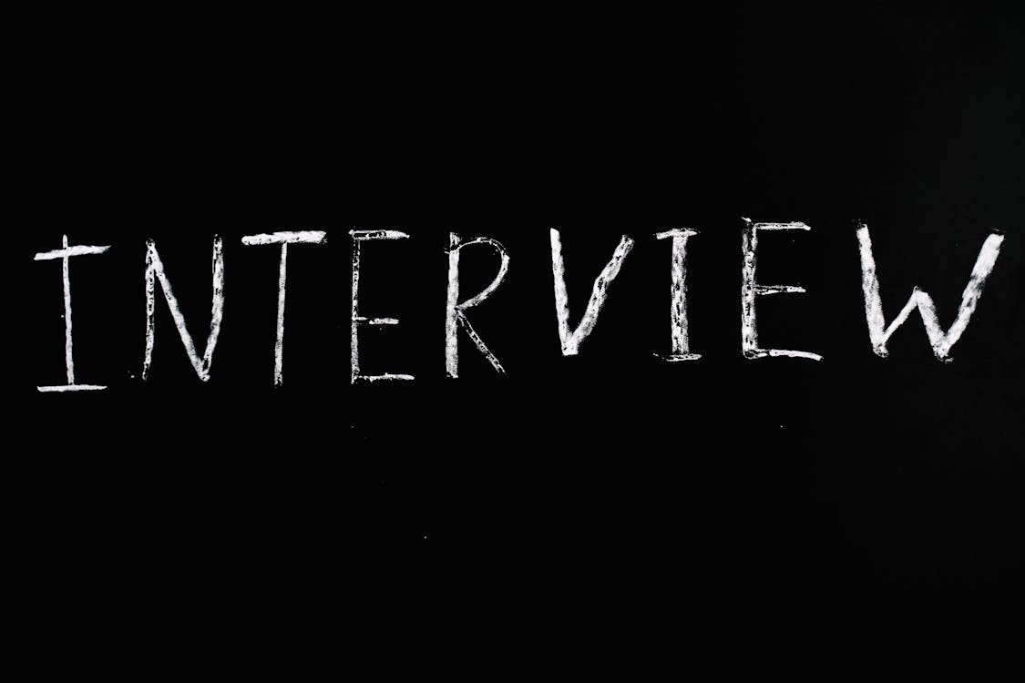 Free A Word Interview on Black Background  Stock Photo