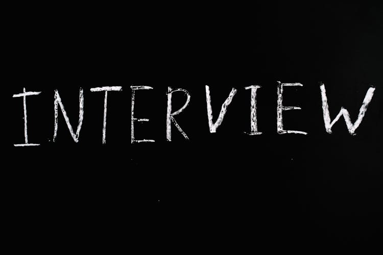 A Word Interview On Black Background 