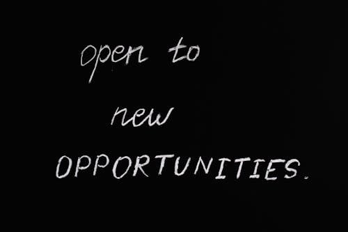 Free Open To New Opportunities Lettering Text on Black Background Stock Photo