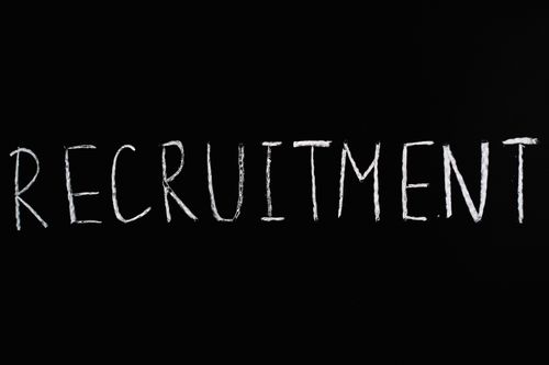 Free Chalk-written 'RECRUITMENT' on a black chalkboard, ideal for HR and hiring themes. Stock Photo