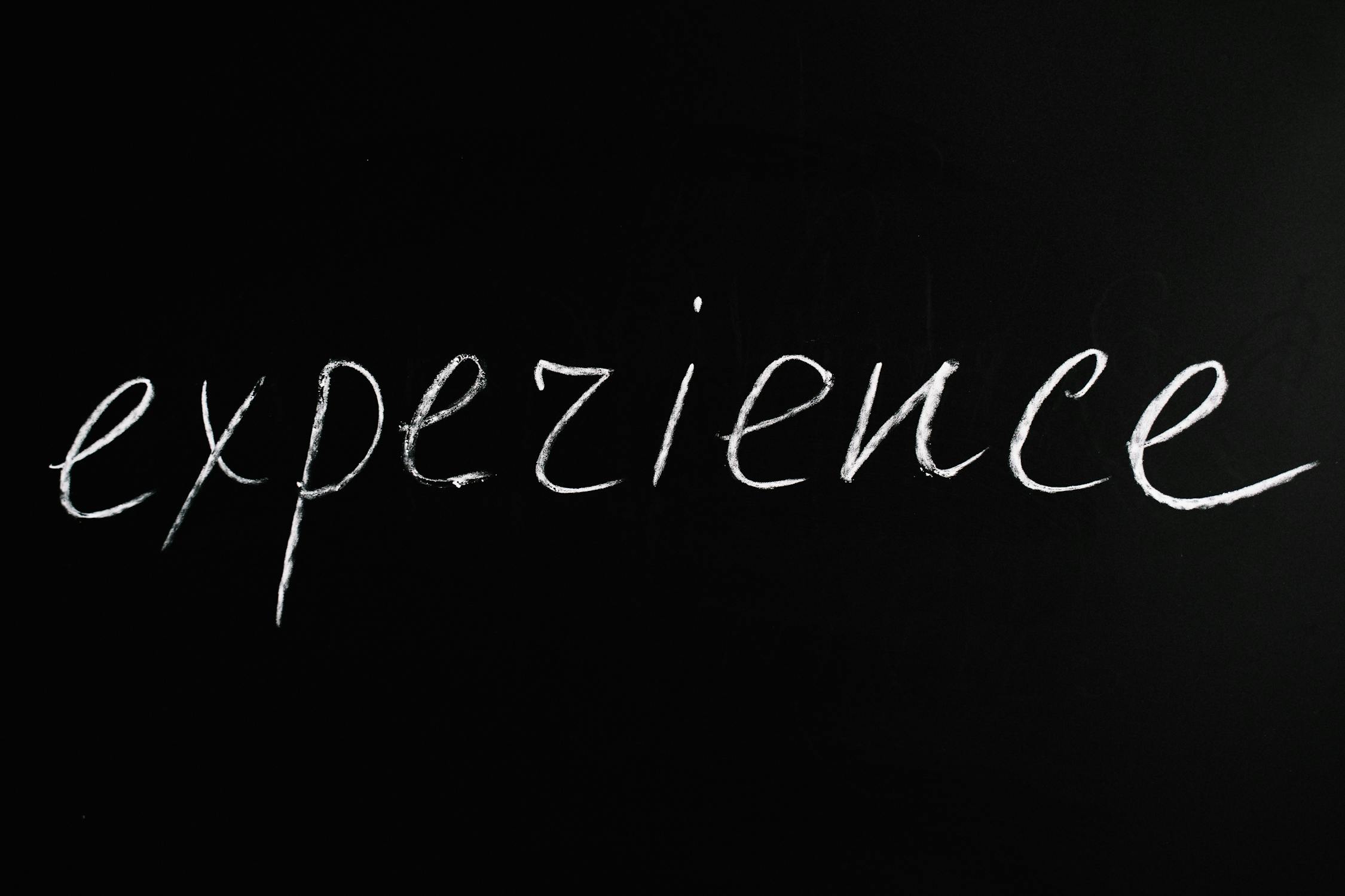 Experience Lettering Text on Black Background · Free Stock Photo