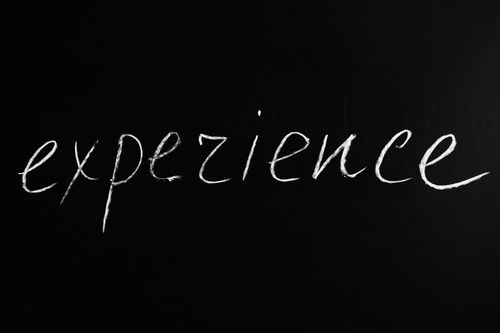 Free Chalkboard showing 'expezience', emphasizing creativity or error. Stock Photo