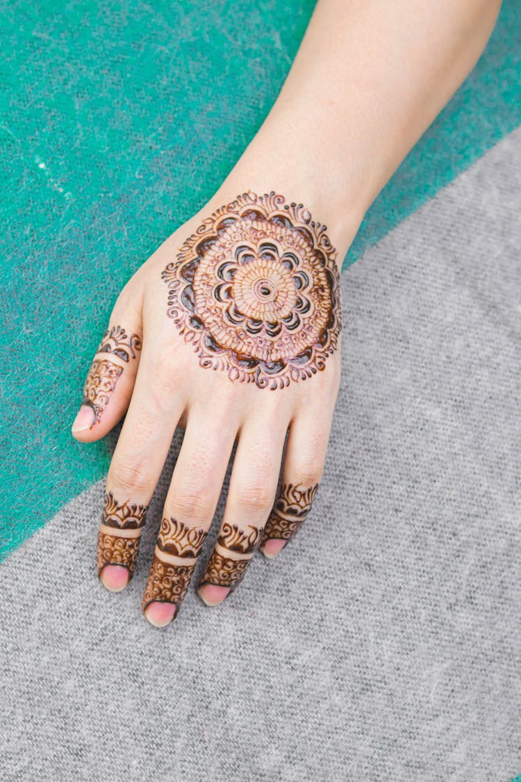 A Person With Henna Tattoo On The Hand