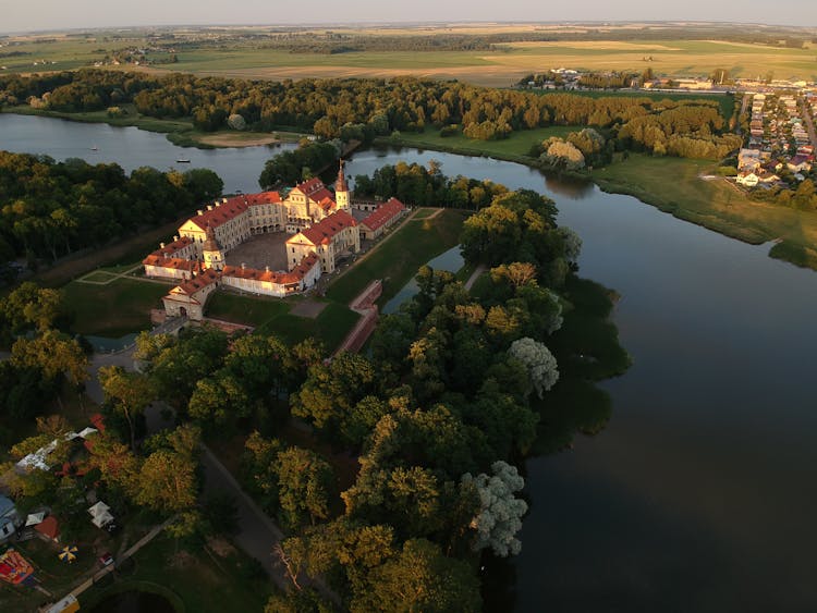 Aerial View Of Palace Hotel Surrounded With Green Trees And River