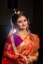 Woman in Red and Gold Sari