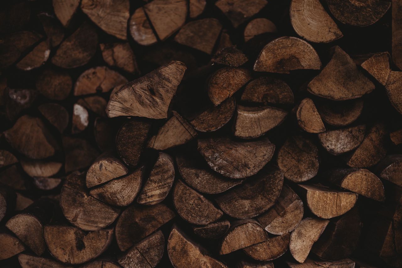 stack of rustic chopped firewood pieces showcasing natural textures an
