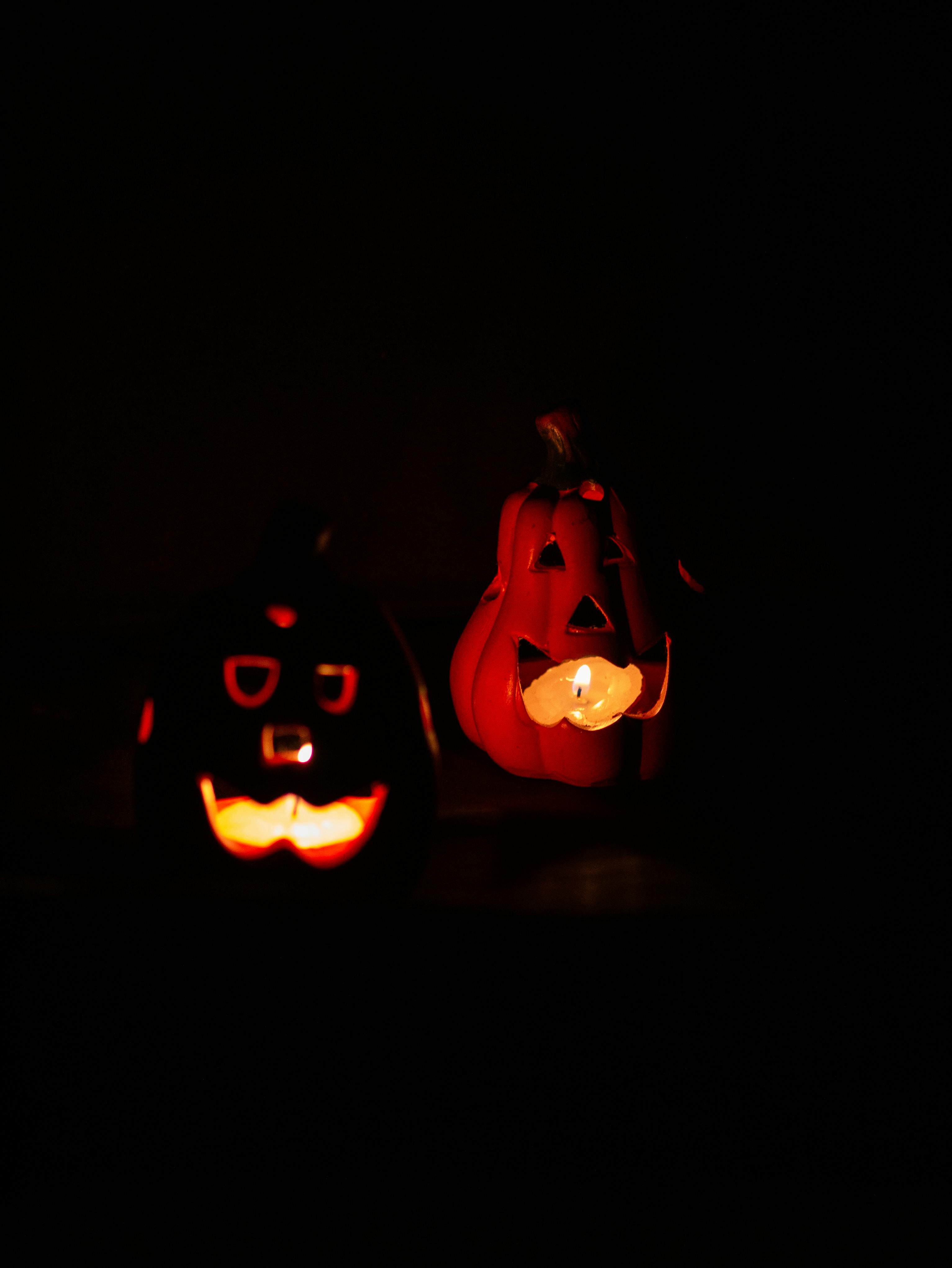 Illuminate your Halloween celebration with these eerie, glowing jack o'lanterns emanating spooky vibes.