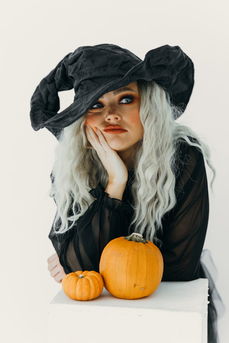 Woman In Witch Costume Feeling Bored