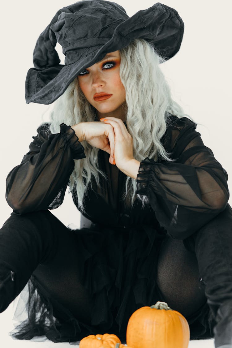 A Beautiful Woman Wearing A Witch Costume