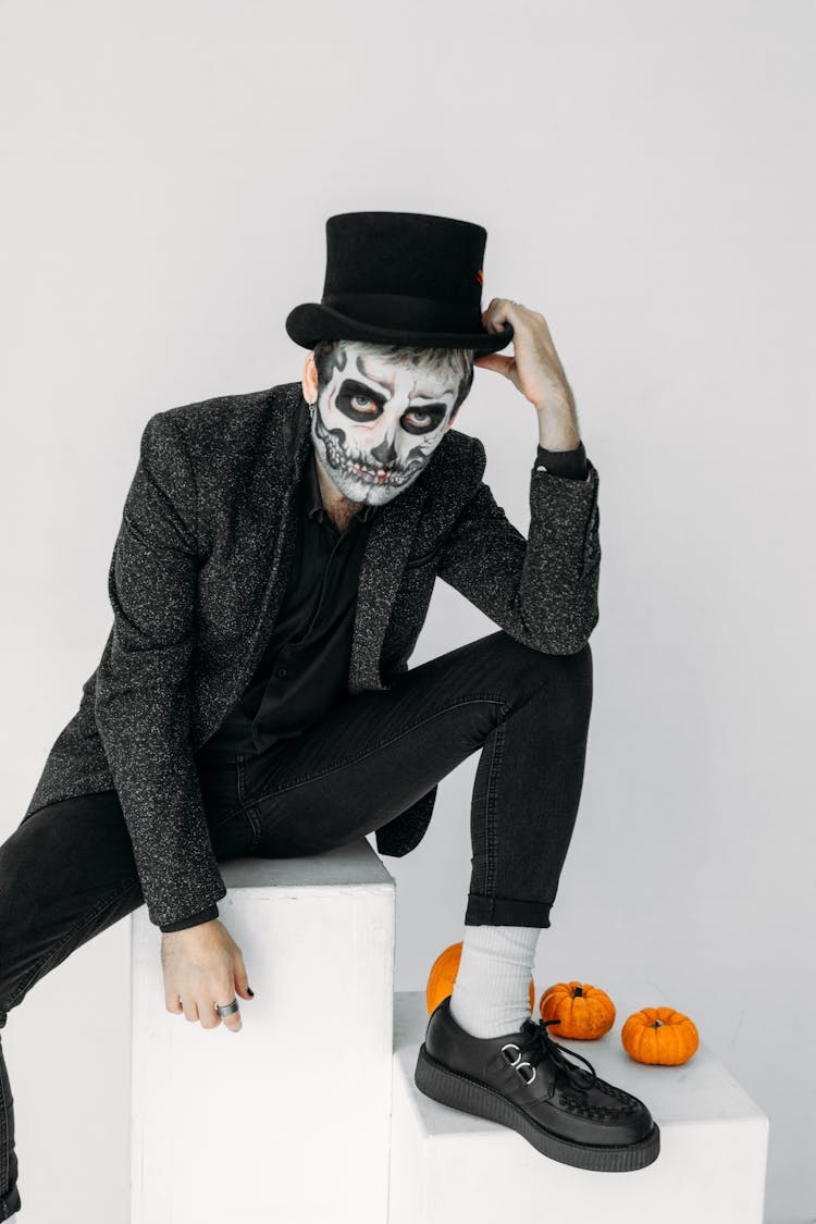 Man In Black Suit Jacket And Black Pants With Scary Face Paint