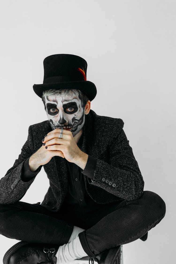 Man In Black Suit With A Scary Face Paint