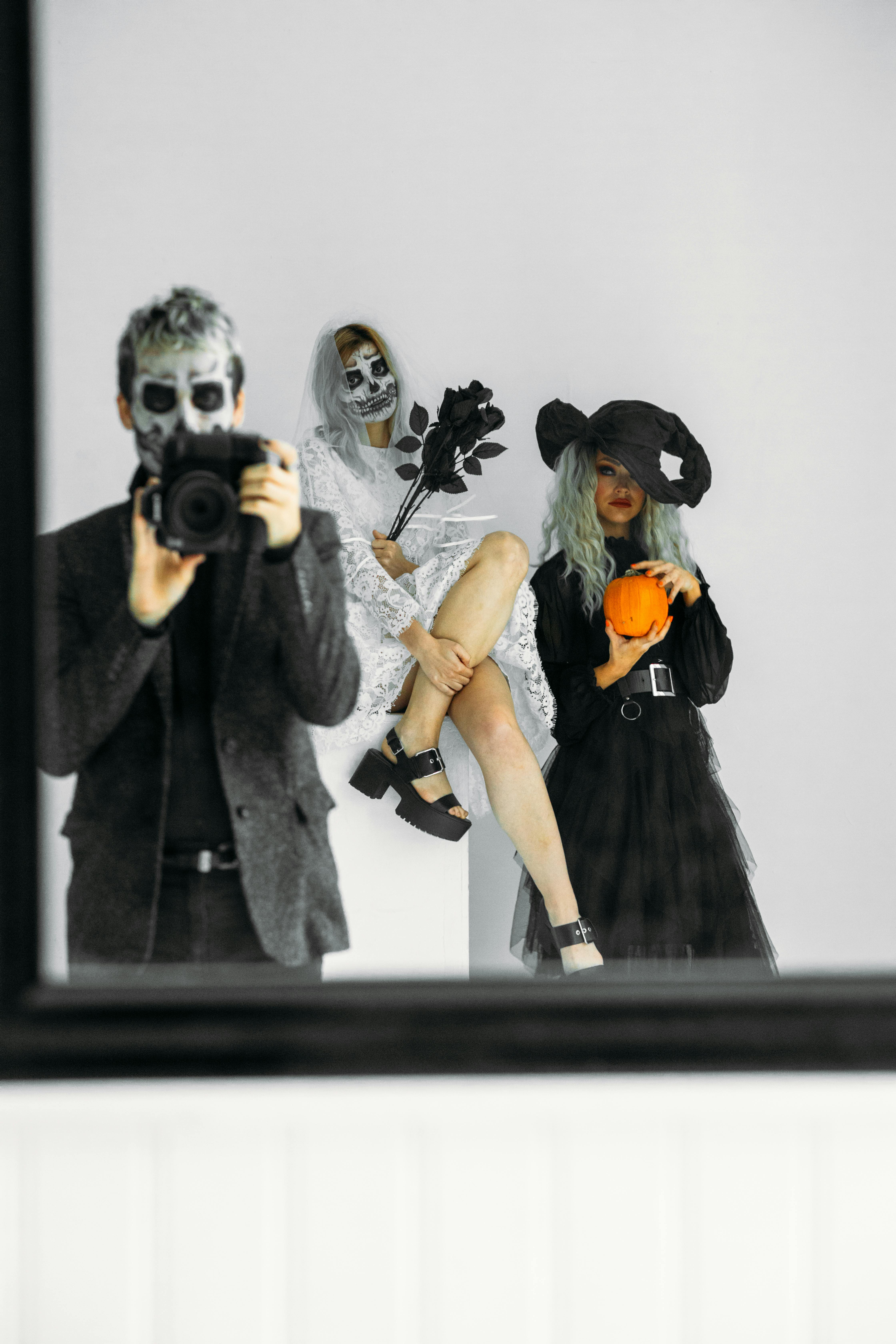 Three People Wearing Halloween Costumes · Free Stock Photo