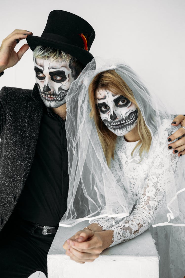 Man And Woman Wearing Skull Face Paint