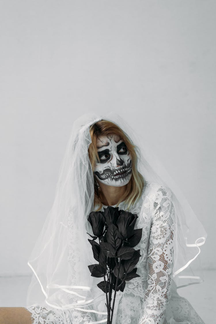 Woman In White Wedding Dress With Face Paint