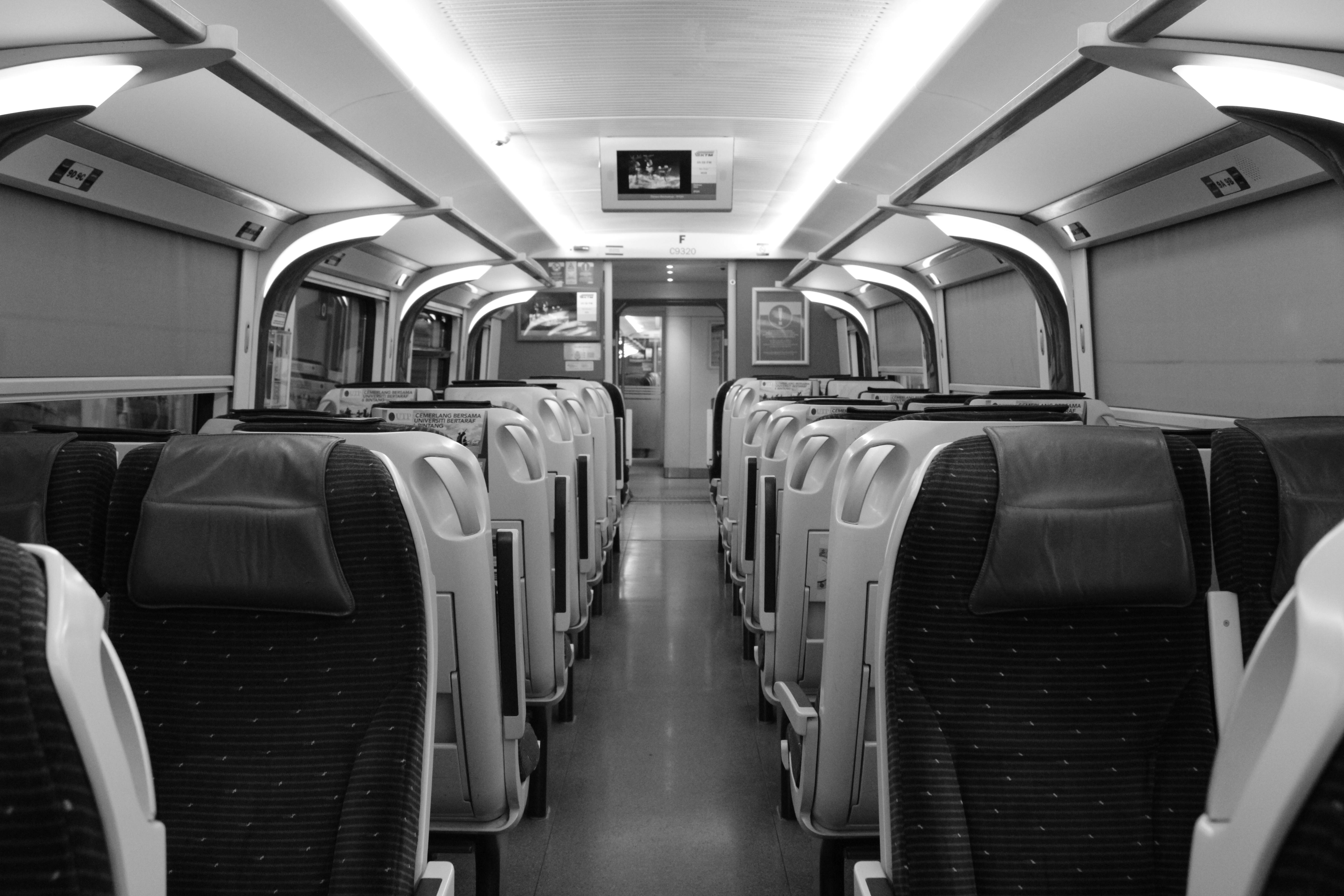 Grayscale Photo of Train Seats · Free Stock Photo