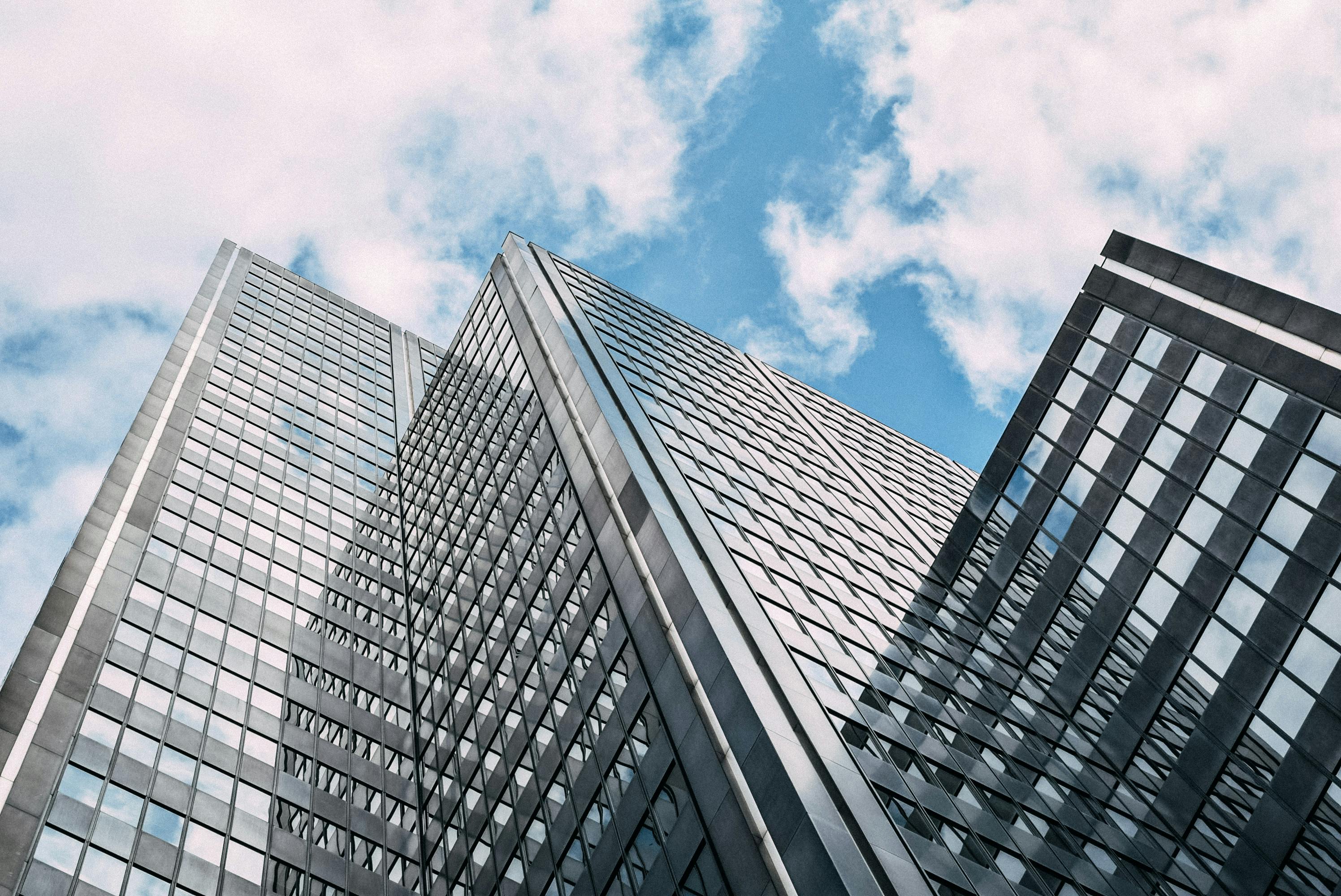 modern skyscraper against cloudy blue sky