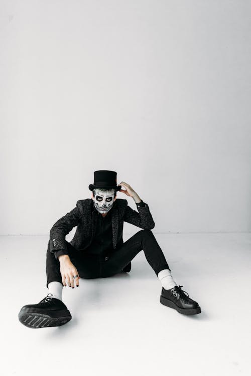 Free Man With Scary Face Paint Sitting On The Floor Stock Photo