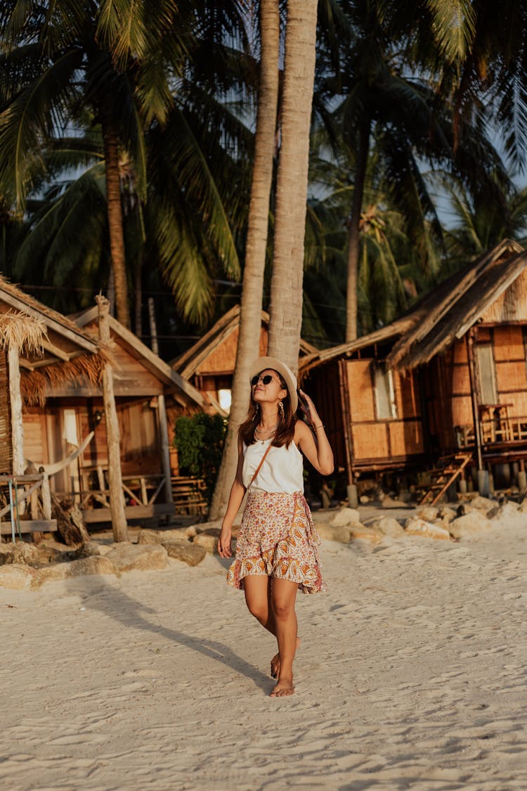 Happy Woman Walking On A Beach Sand