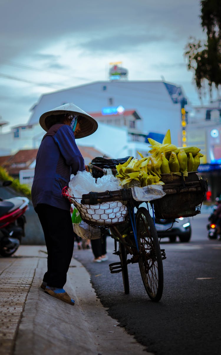 A Woman Selling On The Street