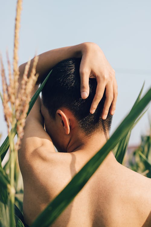 Back View of a Shirtless Person Posing