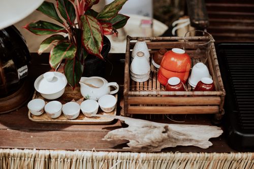 Free Rustic tea set and kitchenware arrangement with greenery, captured from above. Perfect for home decor inspiration. Stock Photo