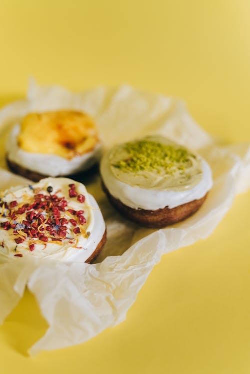 Free White and Brown Pastries on White Paper Stock Photo