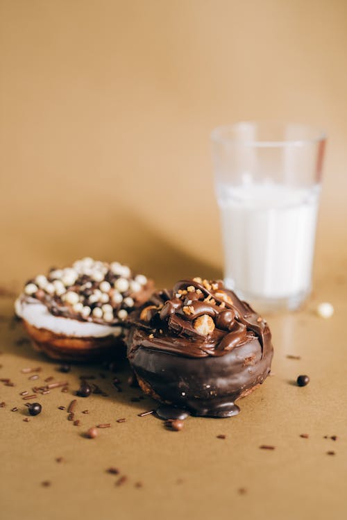 Chocolate Donuts With White Cream on Top