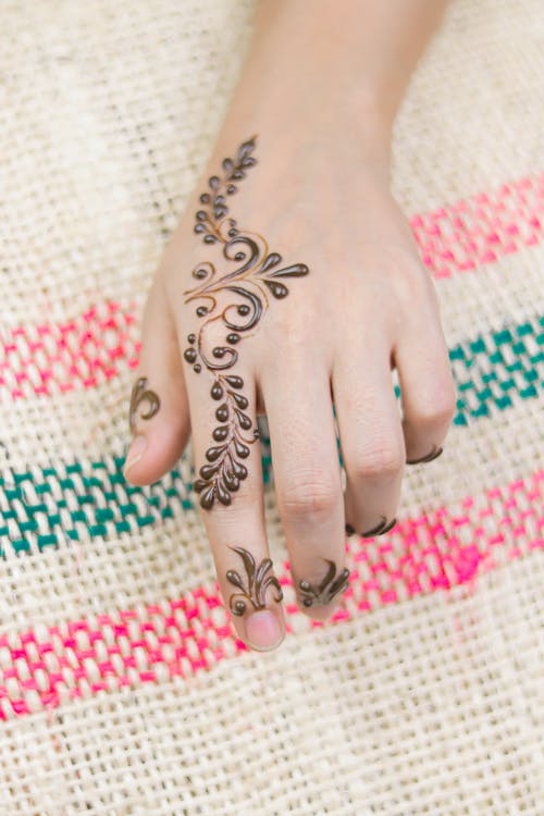 Traditional Floral Design Henna Tattoo on a Woman's Hand · Free Stock Photo