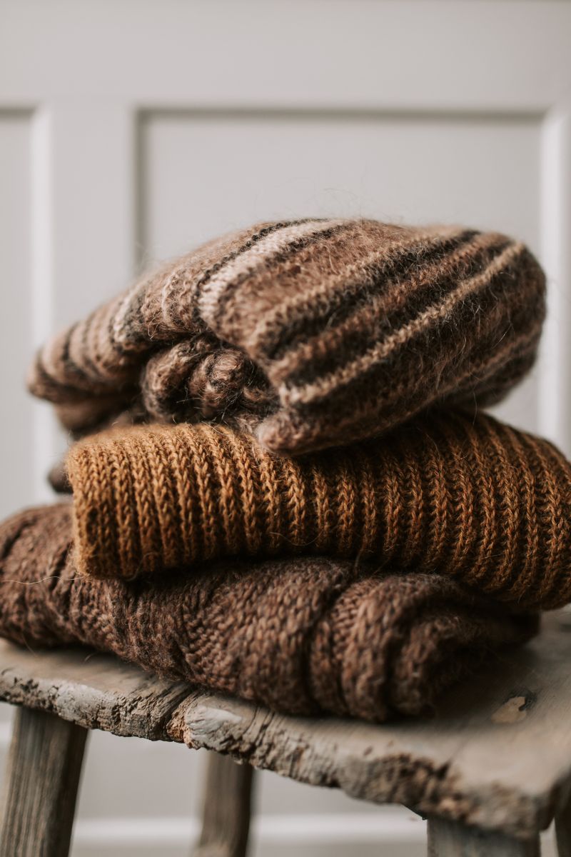 Folded pre-loved sweaters