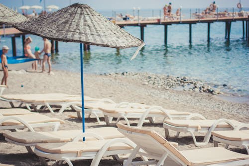 Sun Loungers and Umbrella o Beach