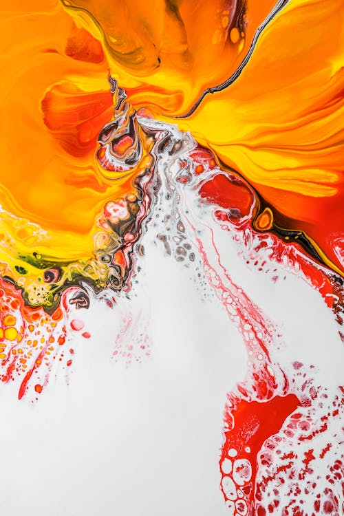 Free Abstract background painting with red splatters on white fluid acrylic paint and orange stains creating original patterns on creative drawing Stock Photo