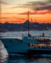 Ferry Boat in Bay at Sunset 